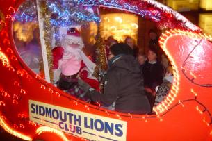 Santa greets some young visitors to Santa\\\'s float at the Sidmouth Late Night Shopping event - 3 December 2010