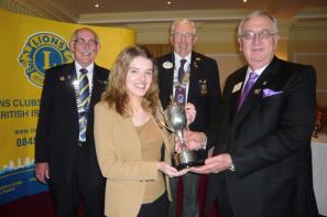 Rachael Hill receiving the Young Ambassador South West District winner\'s award from Lions International 2nd Vice President Wayne Madden, with District Governor Neil Rutter and Sidmouth Lions President Ian Skinner 