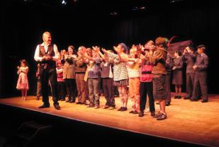 Baz Breadmore on stage with the younger performers at the end of the finale to the Youth Variety Show - April 2011